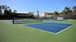 Tennis, pickleball courts and basketball hoop